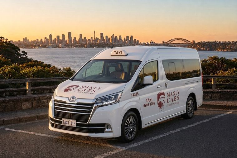 Manly Cabs Independent wheelchair-accessible Toyota HiAce taxi van with Sydney Harbour in the background